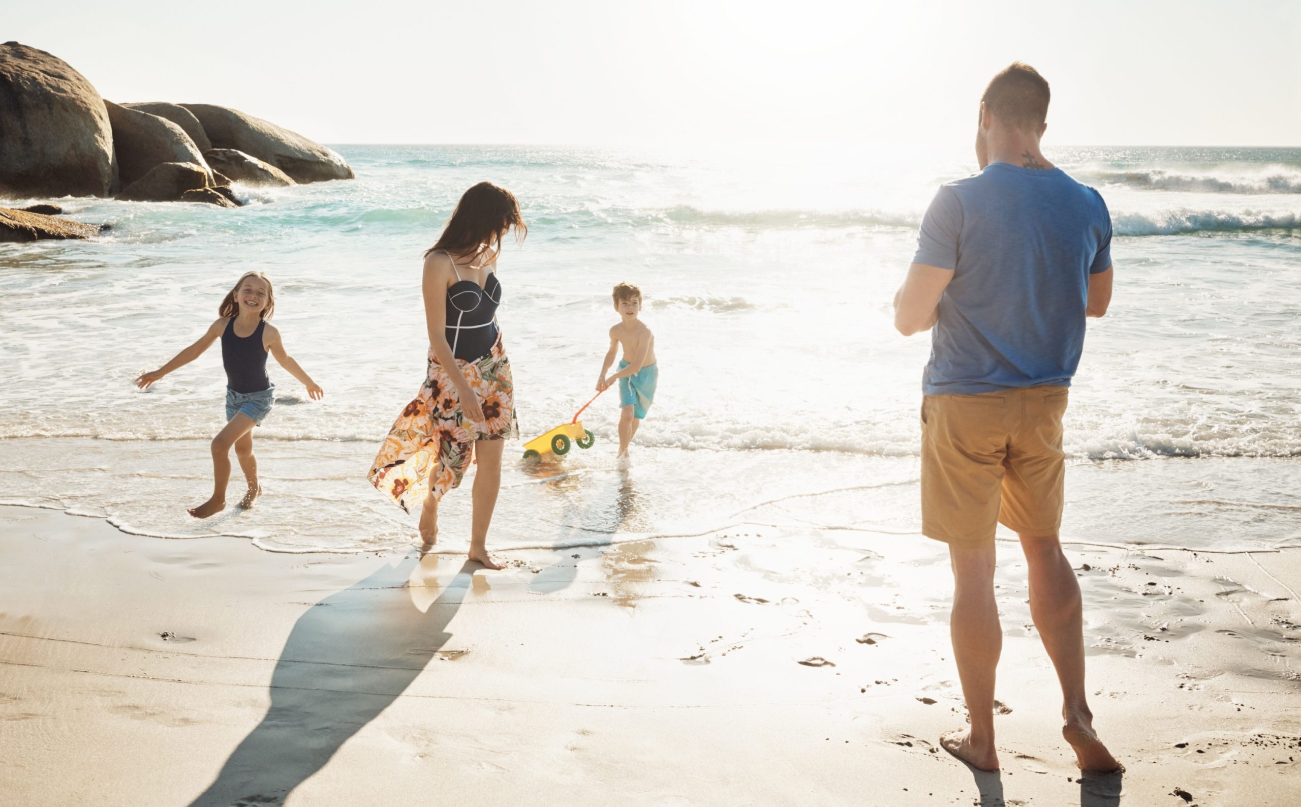 Parents and children playing together on an Italian beach