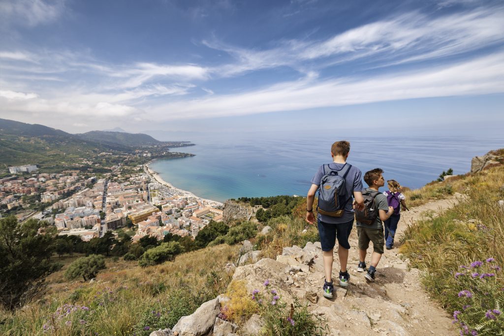 Family excursion on the Tyrrhenian Sea near Cefalu, Sicily, Italy