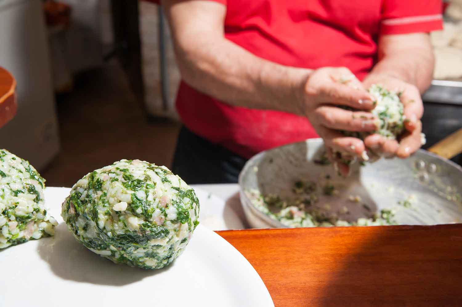 Arancini prepared during a Sicilian cooking lesson, Italy
