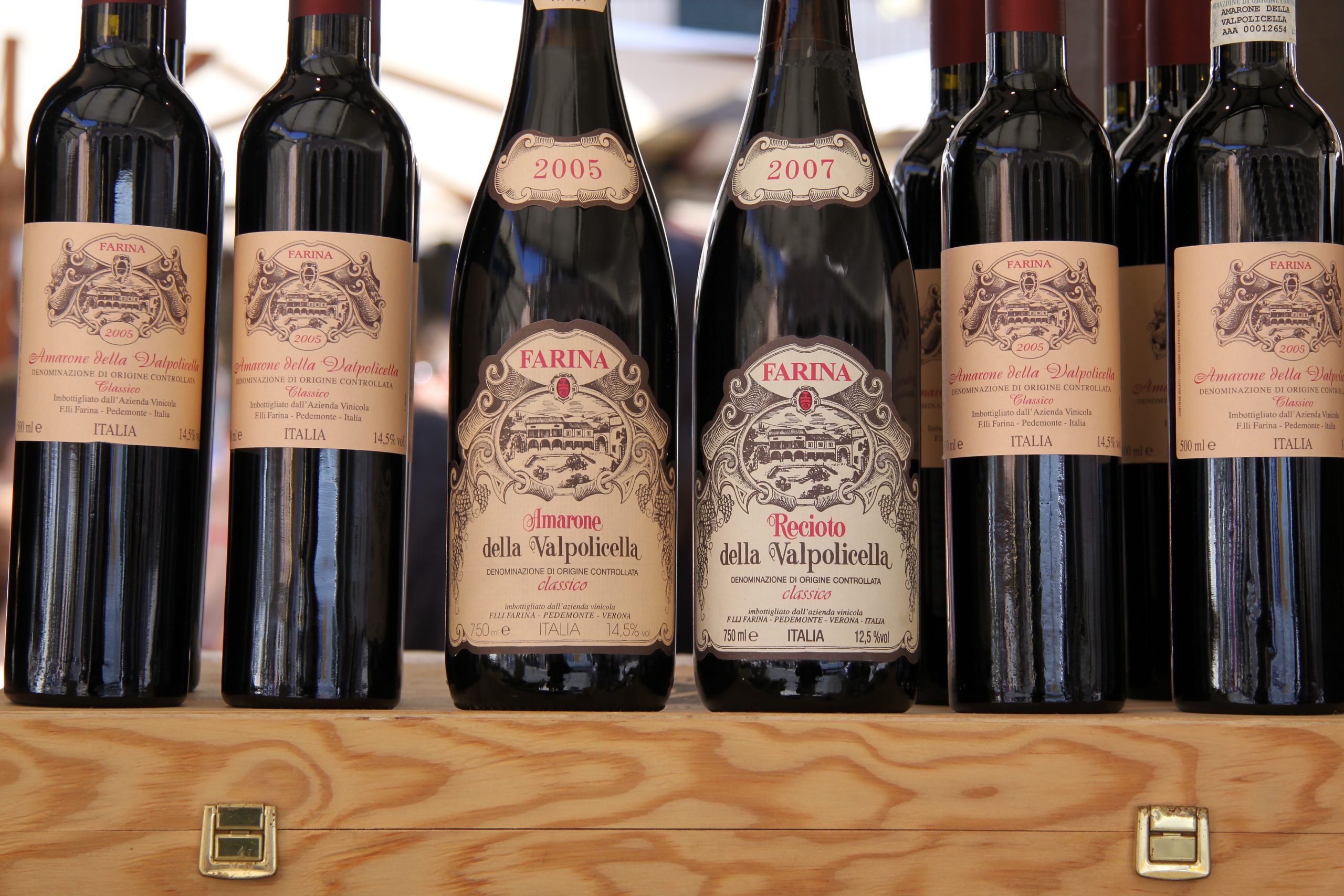 Regional Valpolicella wines displayed at a market stall in Veneto