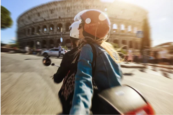 Couple on a Vespa overlooking Rome, Italy